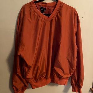 This fun rust jersey is in excellent condition.